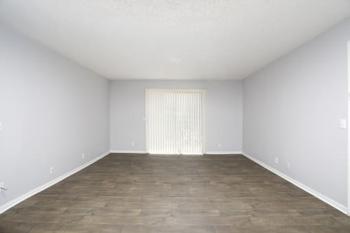 Spacious living room with no furniture