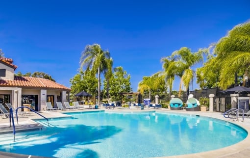 Apartments in Temecula, CA - Vista Promenade Sparkling Swimming Pool Surrounded By Lush Landscaping and Lounge Seating