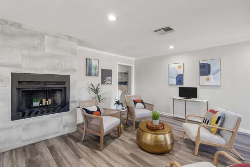 a living room with a fireplace and a tv at Aspire Rialto, Rialto, 92376