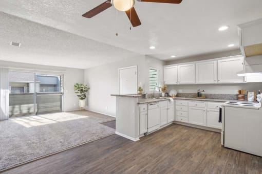 a kitchen and living room with a ceiling fan at Aspire Rialto, California, 92376