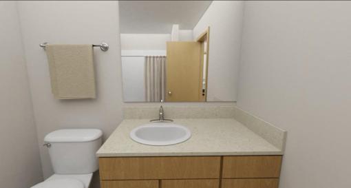A white toilet sits next to a sink in a small bathroom.