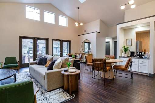 A modern living room with a large couch and a coffee table.