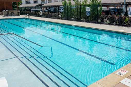 A swimming pool with lane markers and a no-diving sign.