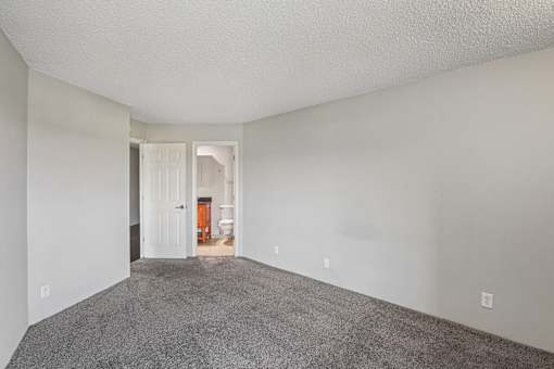 Unfurnished Room with Carpeted Floors at Vista Condominiums, Kansas City, KS