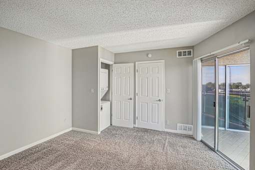 Empty Room with Carpeted Floor at Vista Condominiums, Kansas City, KS