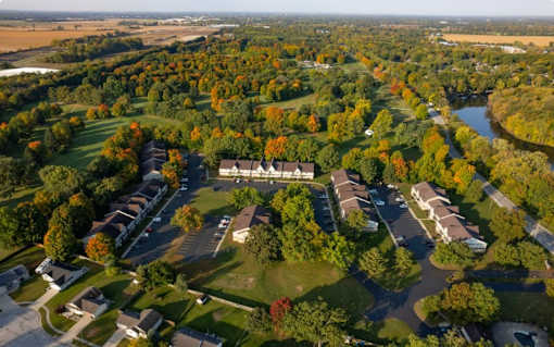 A bird's eye view of a residential area with houses and trees.