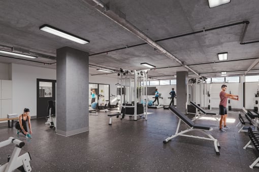 an image of a gym with people working out in it