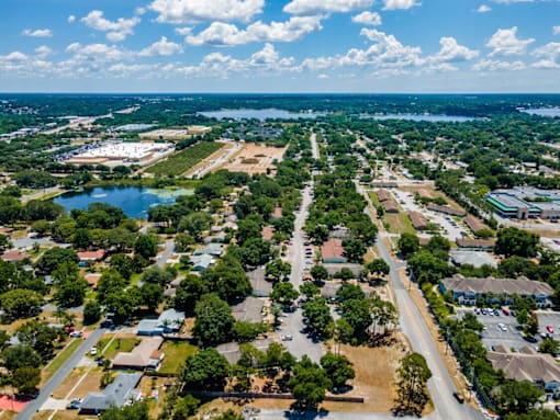 A view of a residential area with a road running through it.