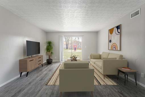A living room with a grey carpet and a brown sofa.
