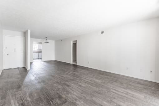 a living room with hardwood floors at Jacksonville Heights Apartments