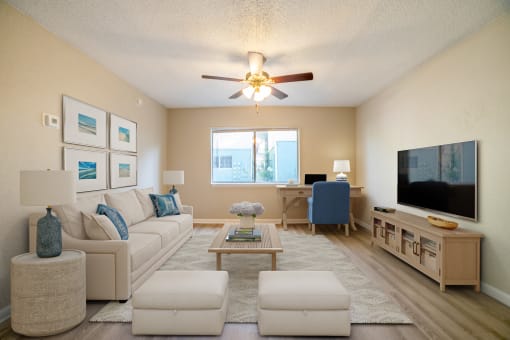 a furnished living room with a ceiling fan at Lago Bello Apartment