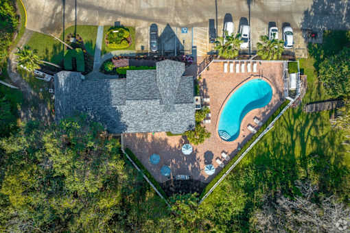 A large house with a pool in the backyard.