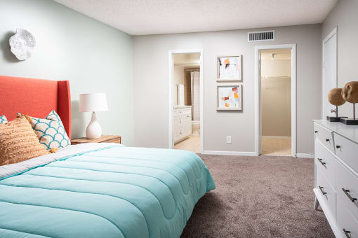 a bedroom with a bed and a closet at Fairways of Inverrary, Florida