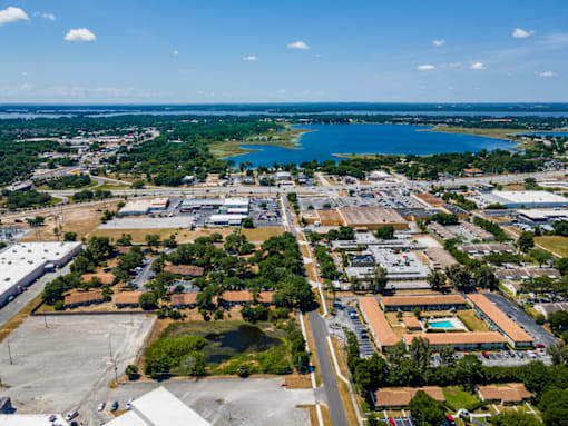 A large industrial area with a lake in the distance.