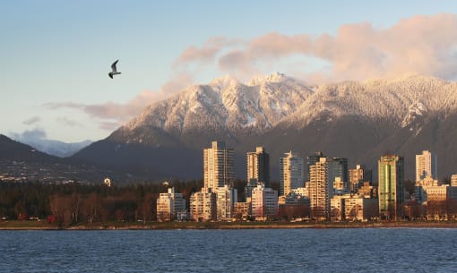 a view of the city of vancouver with mountains in the background