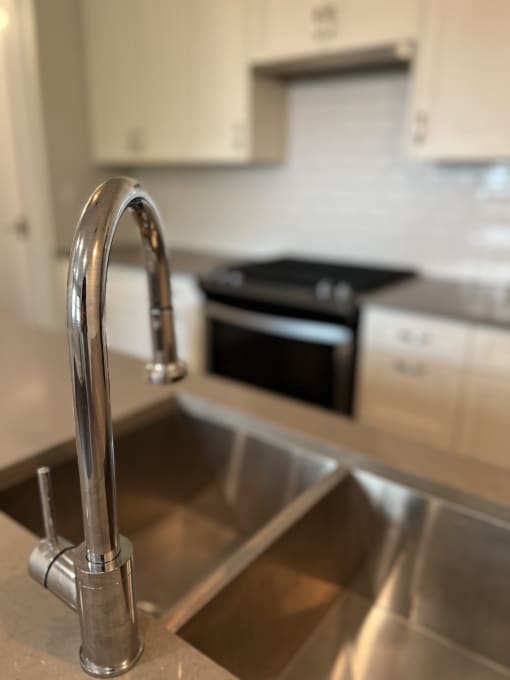 a kitchen with a sink and a stove