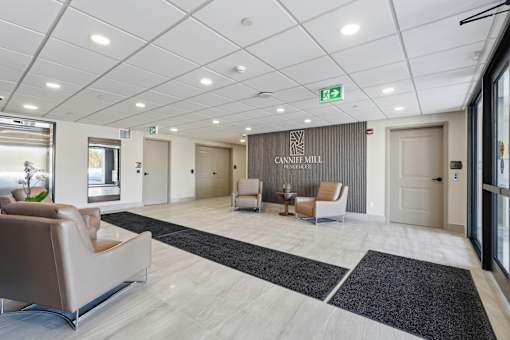 A spacious lobby area with a reception desk and seating arrangements.