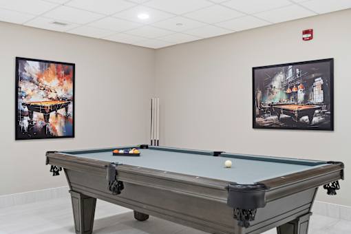 A pool table with a white ball on it.