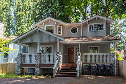 a house with a front porch and steps leading up to it