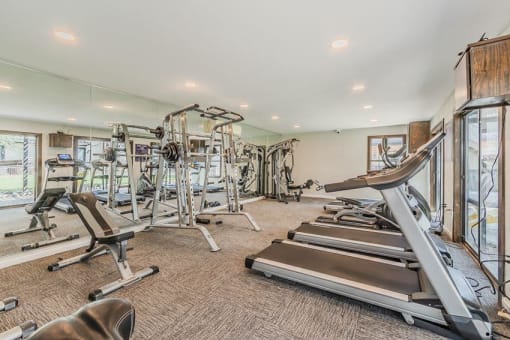 the gym is equipped with a variety of exercise equipment at Cityscape, Dallas, TX