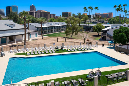 an aerial view of the pool at the resort on a sunny day at Presidio Palms Apartments, Tucson, 85701
