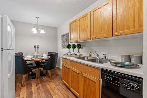 kitchen with wood cabinets and dining room