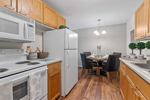 kitchen and dining room with white fridge