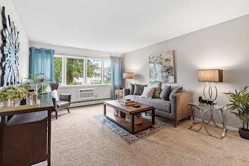 living room with sofa and large window