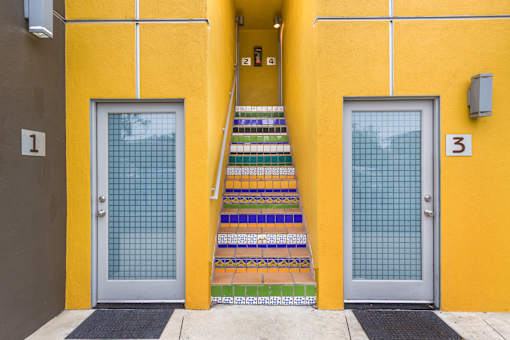 Exterior view of The Edge with a staircase leading to the second floor.