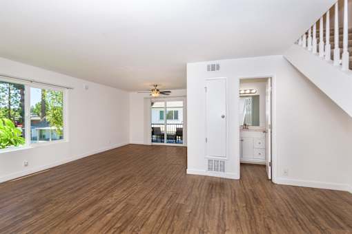 A large living room with wooden floors