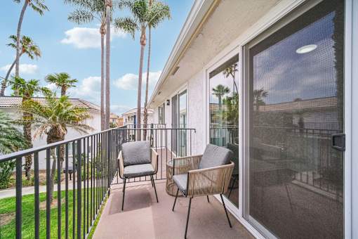 A patio with table and chairs at villa campana