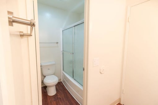 bathroom with toilet and shower/tub combo
