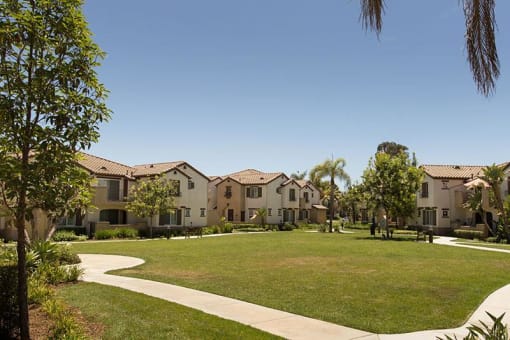 a grassy area in a courtyard at Villas at the Park