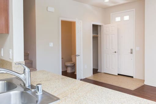entry way with view of closet and bathroom