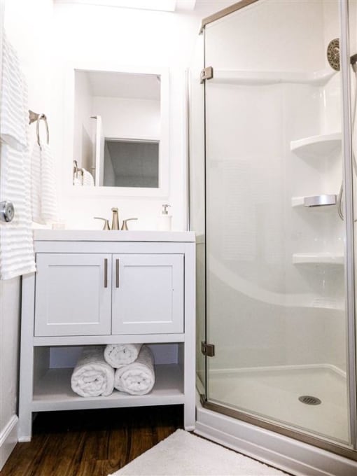 a bathroom with sink and shower