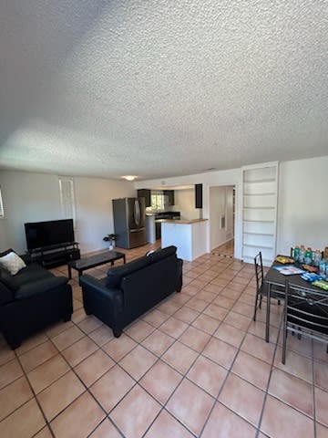 a living room with a couch and a table