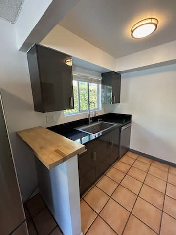 a kitchen with a sink and a counter top