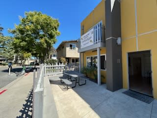 a building with a picnic table outside of it