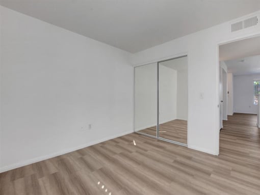 an empty room with a sliding glass door