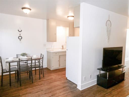 a kitchen and dining room with a table