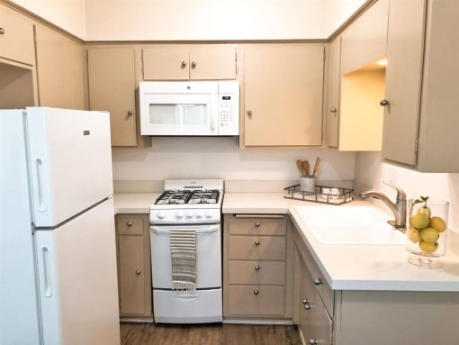 a kitchen with a stove microwave and refrigerator