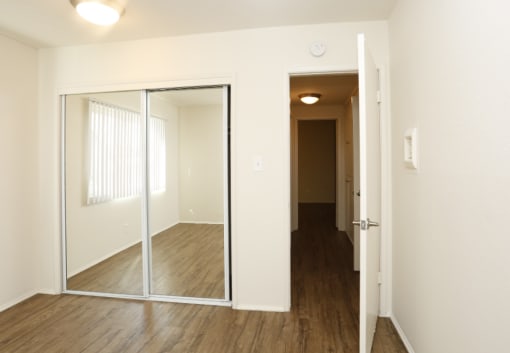 bedroom with mirrored closet