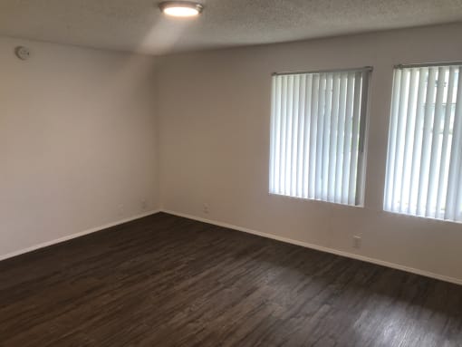 large bedroom with windows