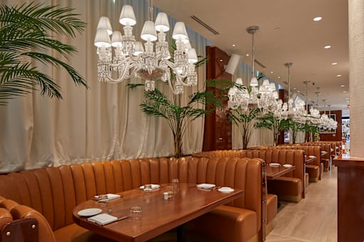 Elegant restaurant dining room with chandeliers at Bay One Apartments, New Jersey, 07002