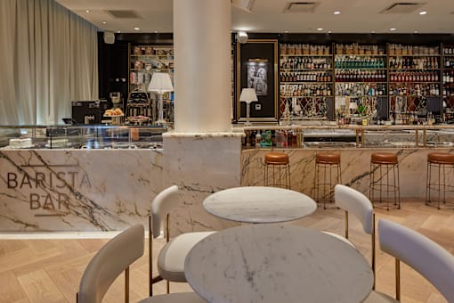 Barista bar with marble countertop and cafe seating at Bay One Apartments, Bayonne, NJ 07002