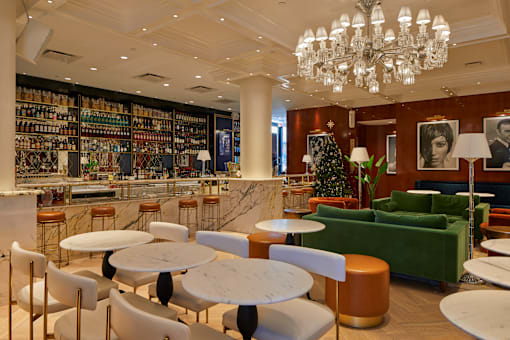 Upscale lounge with marble bar and chandelier at Bay One Apartments, Bayonne, NJ