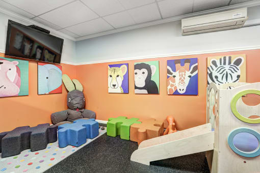 Room with wall of animal paintings  at RiversEdge, Weehawken, New Jersey