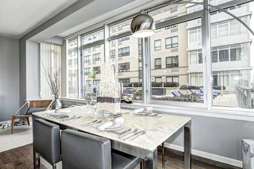 Dining room with table at RiversEdge, Weehawken, New Jersey
