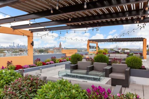 a rooftop terrace with a view of the philadelphia skyline