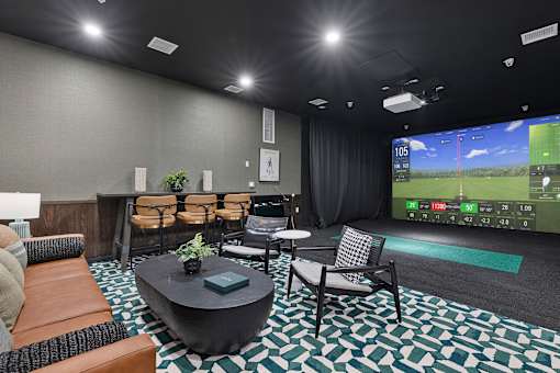 Indoor golf simulator entertainment lounge at Aster Grove Apartments, Warren, New Jersey